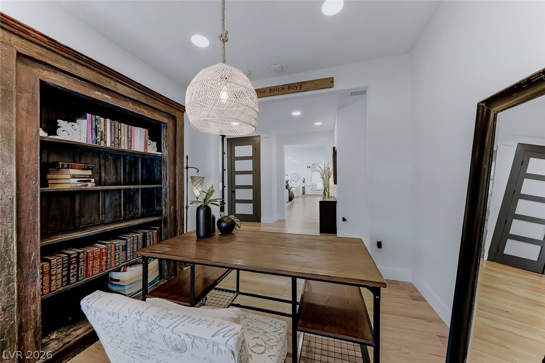 2601 Arimo Drive, Henderson, NV 89052 Recessed lighting and warm wood flooring enhance this versatile home office or entryway space.