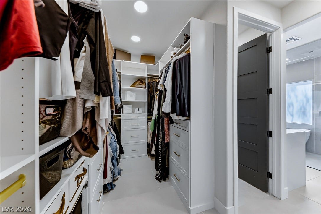 2601 Arimo Drive, Henderson, NV 89052 Ample storage options define this thoughtfully configured walk-in closet space.