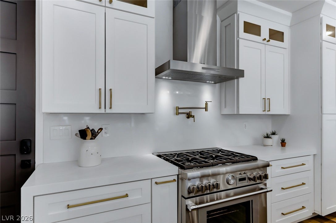 2601 Arimo Drive, Henderson, NV 89052 High-end stainless steel appliances and custom cabinetry define this elegant culinary space.