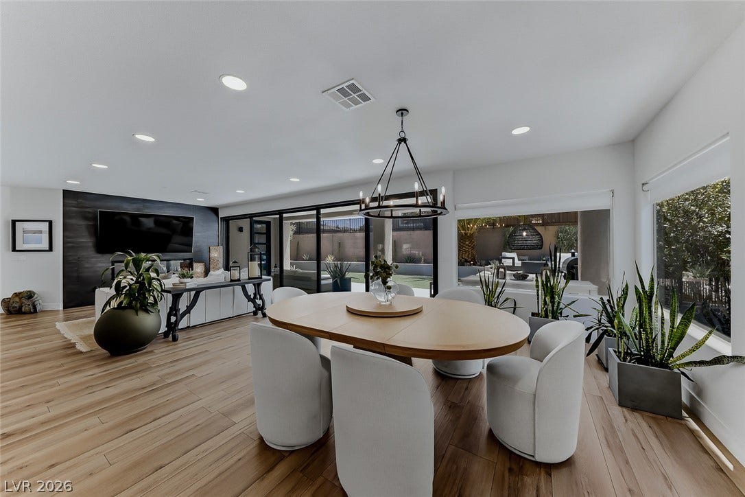 2601 Arimo Drive, Henderson, NV 89052 Gleaming wood floors and recessed lighting anchor this open dining and living area.