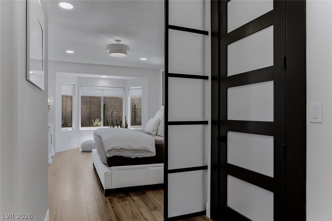 2601 Arimo Drive, Henderson, NV 89052 Smooth wood floors and recessed lighting enhance this bright bedroom entryway.