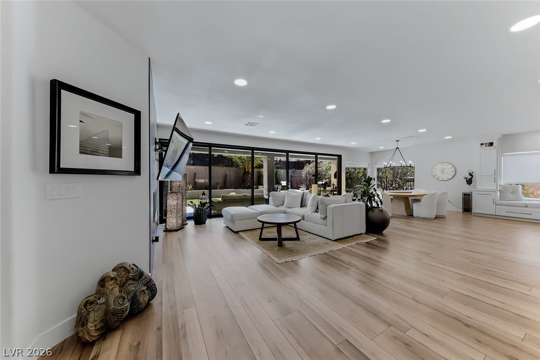2601 Arimo Drive, Henderson, NV 89052 Recessed lighting illuminates this open living space anchored by warm wood floors.