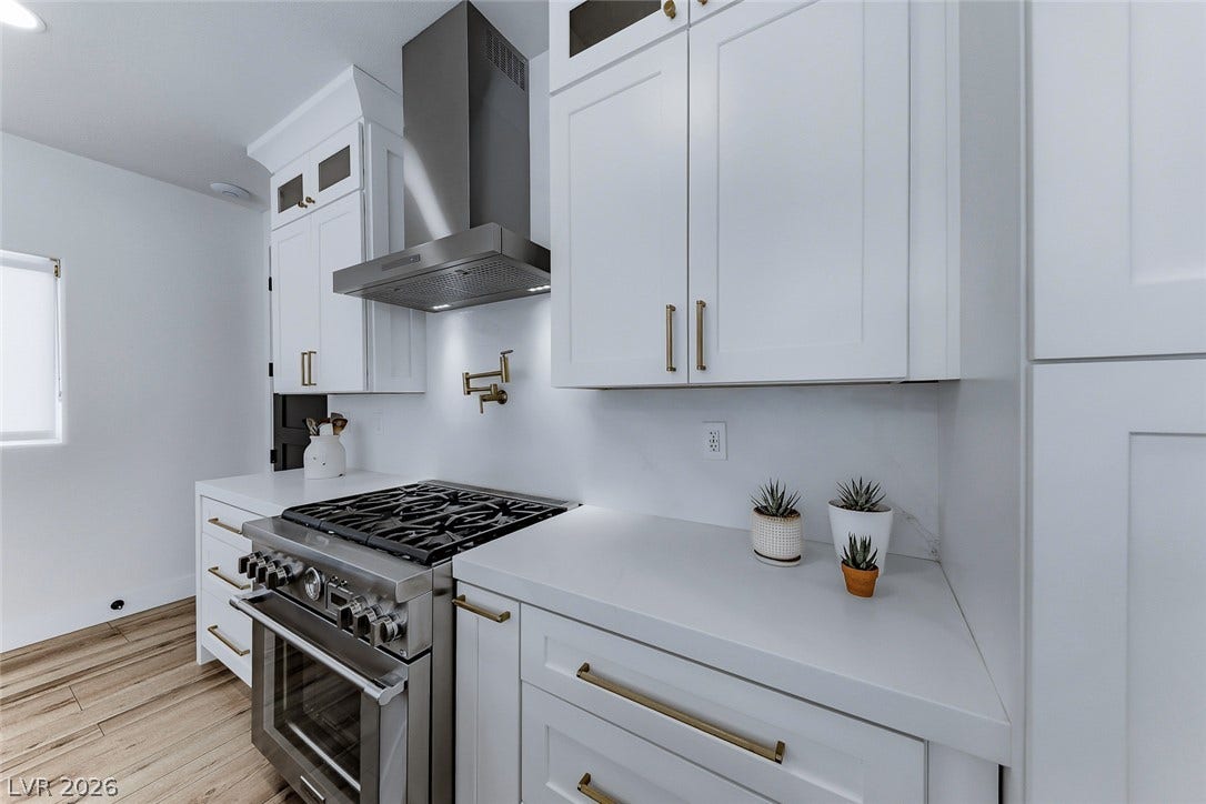 2601 Arimo Drive, Henderson, NV 89052 Crisp white cabinetry pairs perfectly with a professional gas range and sleek quartz countertops.