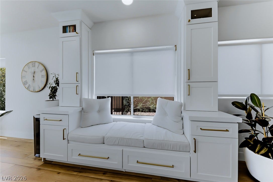2601 Arimo Drive, Henderson, NV 89052 Custom built-in cabinetry frames a cozy window seat above rich hardwood flooring.
