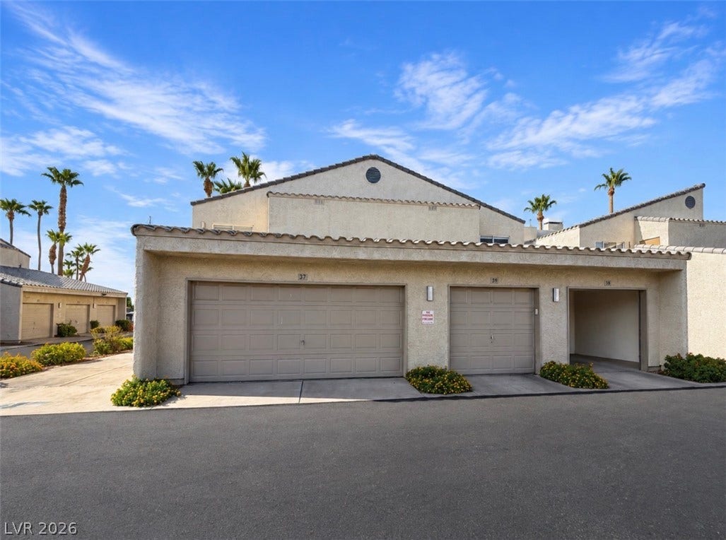 6250 W Flamingo Road, #37, Las Vegas, NV 89103 Spanish tile accents and integrated garages create a timeless stucco exterior profile.