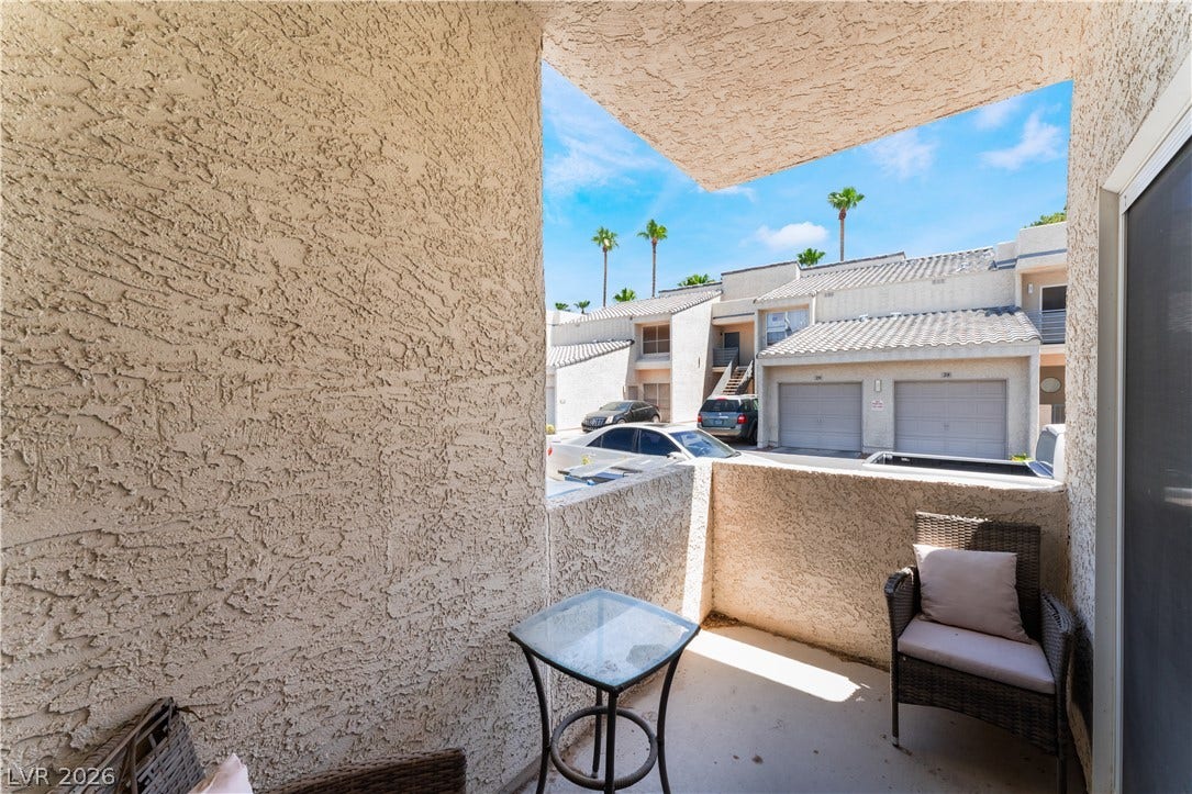 6250 W Flamingo Road, #37, Las Vegas, NV 89103 Enjoy outdoor living on this private patio, offering a refreshing view of palm trees and community amenities.