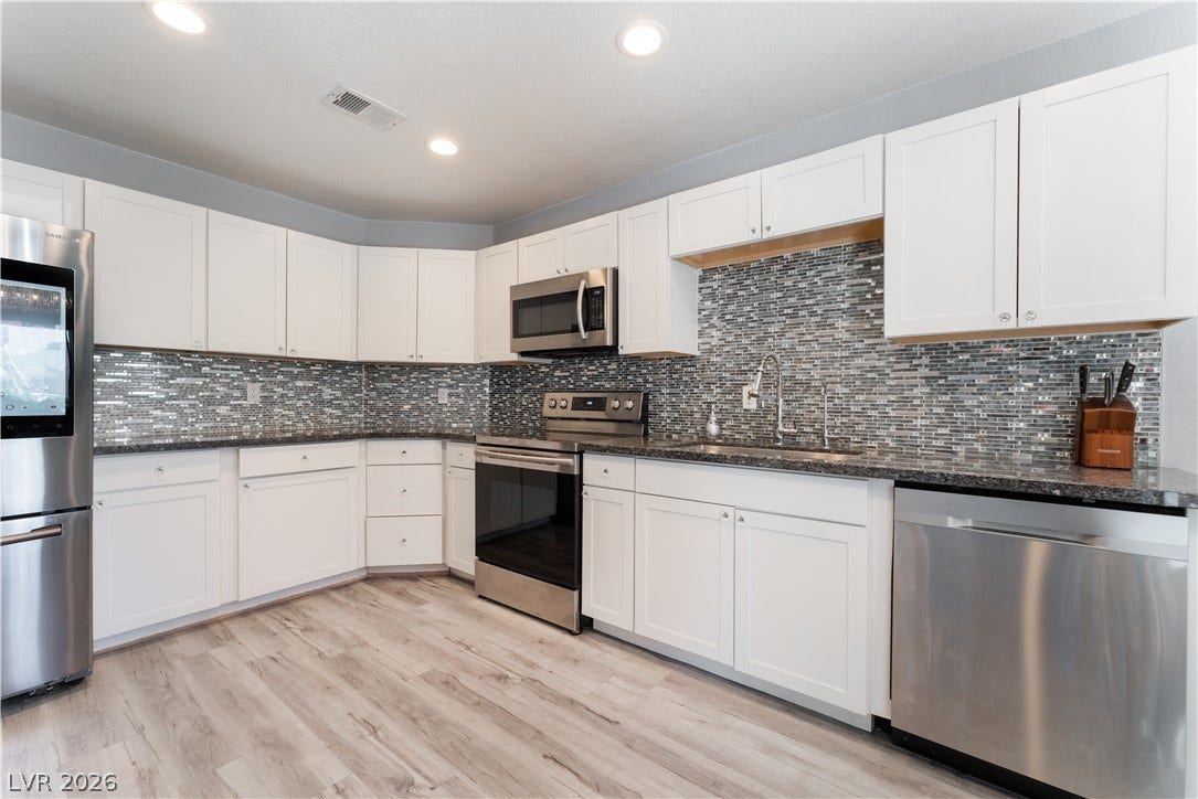 6250 W Flamingo Road, #37, Las Vegas, NV 89103 A well-appointed kitchen showcasing contemporary finishes and sleek stainless steel appliances.