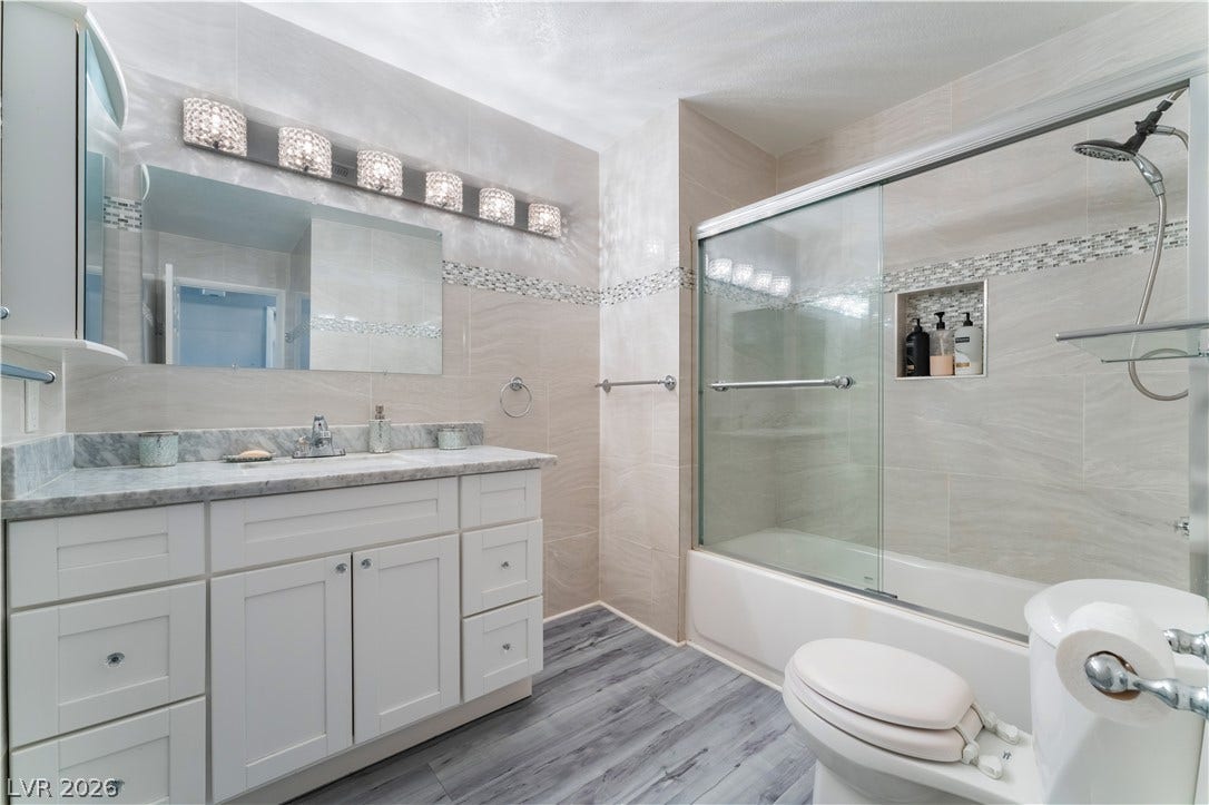 6250 W Flamingo Road, #37, Las Vegas, NV 89103 A well-appointed bathroom features a spacious vanity and a sleek shower-over-tub design.