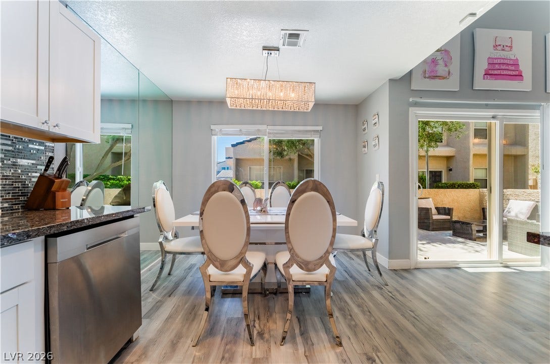 6250 W Flamingo Road, #37, Las Vegas, NV 89103 Dine in an open setting with immediate access to an outdoor lounging area, perfect for entertaining.