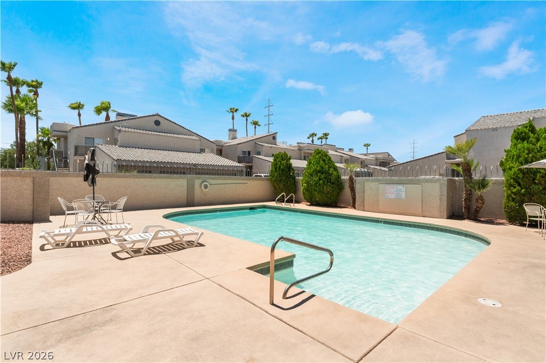 6250 W Flamingo Road, #37, Las Vegas, NV 89103 An inviting community pool with ample patio space offers a refreshing escape amidst lush landscaping.