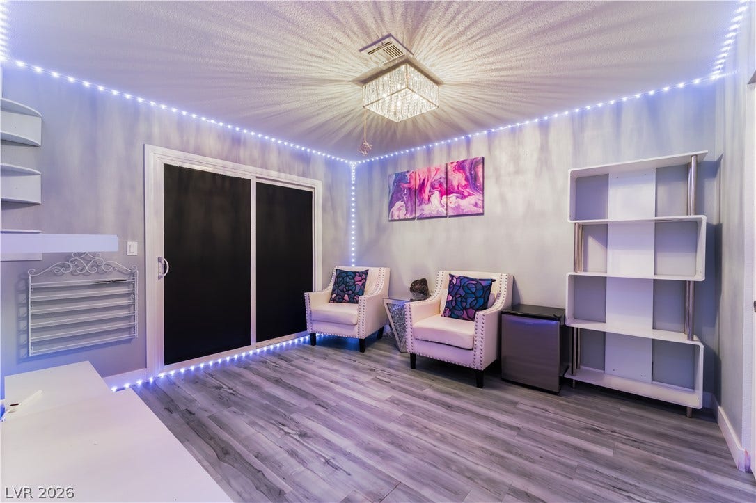 6250 W Flamingo Road, #37, Las Vegas, NV 89103 Recessed lighting illuminates this versatile room featuring durable laminate flooring and sliding doors for flexible space utilization.