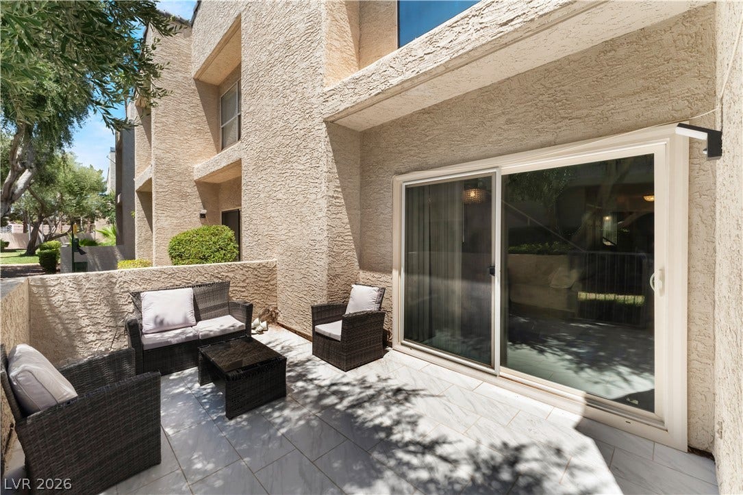 6250 W Flamingo Road, #37, Las Vegas, NV 89103 An inviting private patio space, perfect for outdoor enjoyment, features elegant tile flooring and seamless indoor-outdoor access.