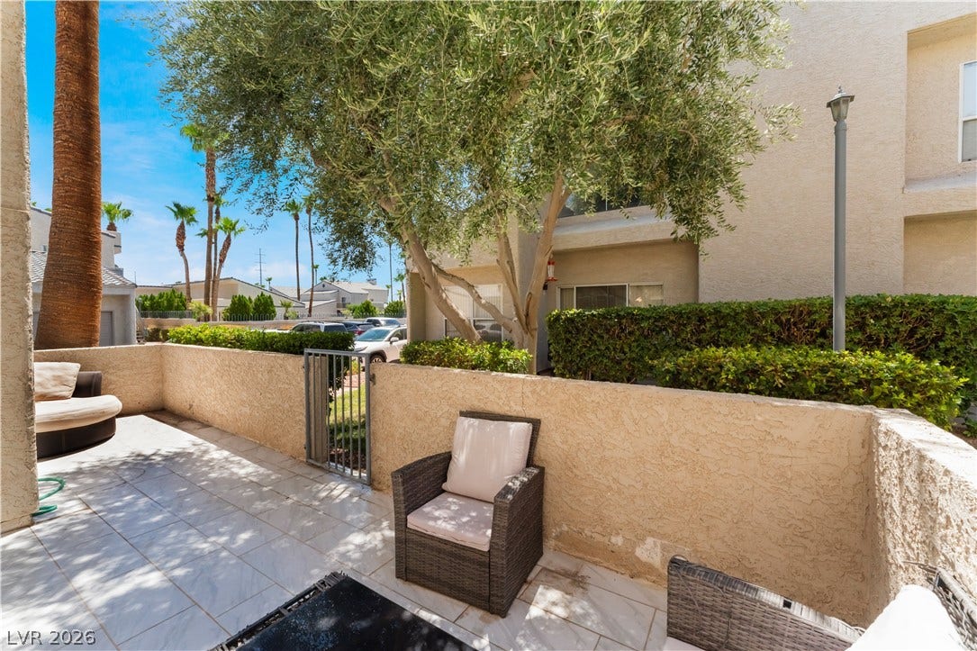 6250 W Flamingo Road, #37, Las Vegas, NV 89103 A private, sun-drenched patio provides a peaceful outdoor retreat, perfect for relaxation or intimate gatherings.