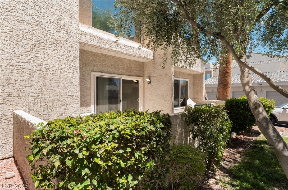 6250 W Flamingo Road, #37, Las Vegas, NV 89103 A well-maintained shrubbery offers a private outdoor space for this residence.