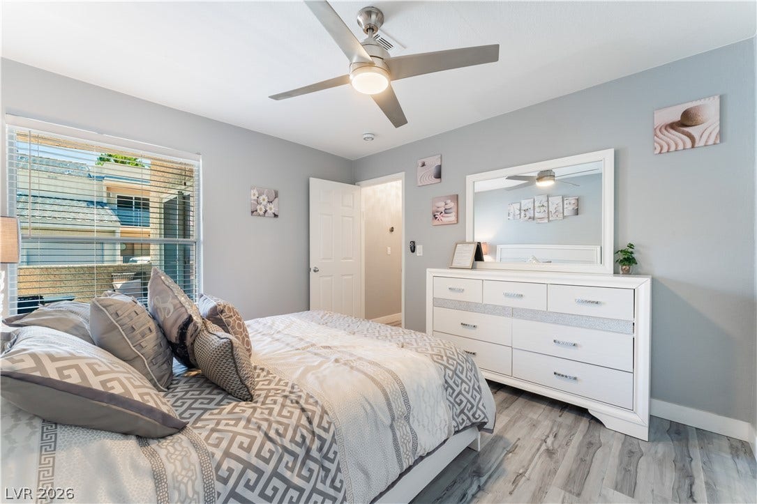 6250 W Flamingo Road, #37, Las Vegas, NV 89103 A restful chamber with cool-toned walls and wood-look flooring invites relaxation.