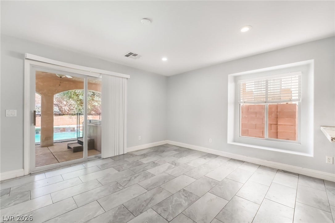 Unfurnished room featuring baseboards and recessed lighting