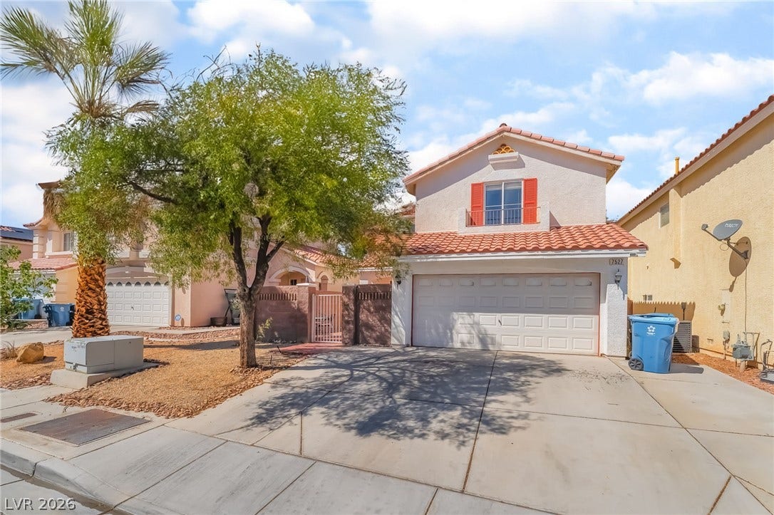 Mediterranean / spanish-style house featuring a garage, a tiled roof, stucco siding, concrete driveway, and a gate
