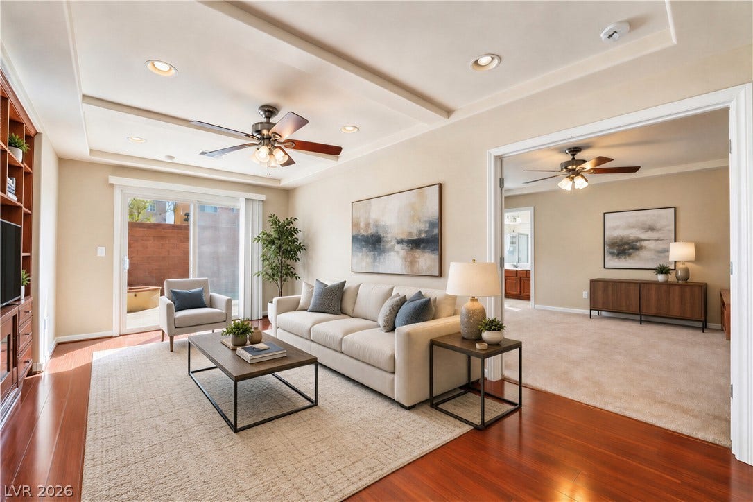 6771 Bravura Court, Las Vegas, NV 89139 Gleaming hardwood floors and a tray ceiling define this inviting, open-concept living space.