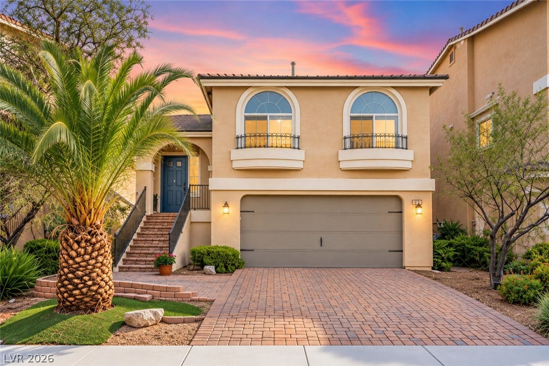 6771 Bravura Court, Las Vegas, NV 89139 An elegant stucco exterior and a paved driveway welcome you to this beautiful two-story home.