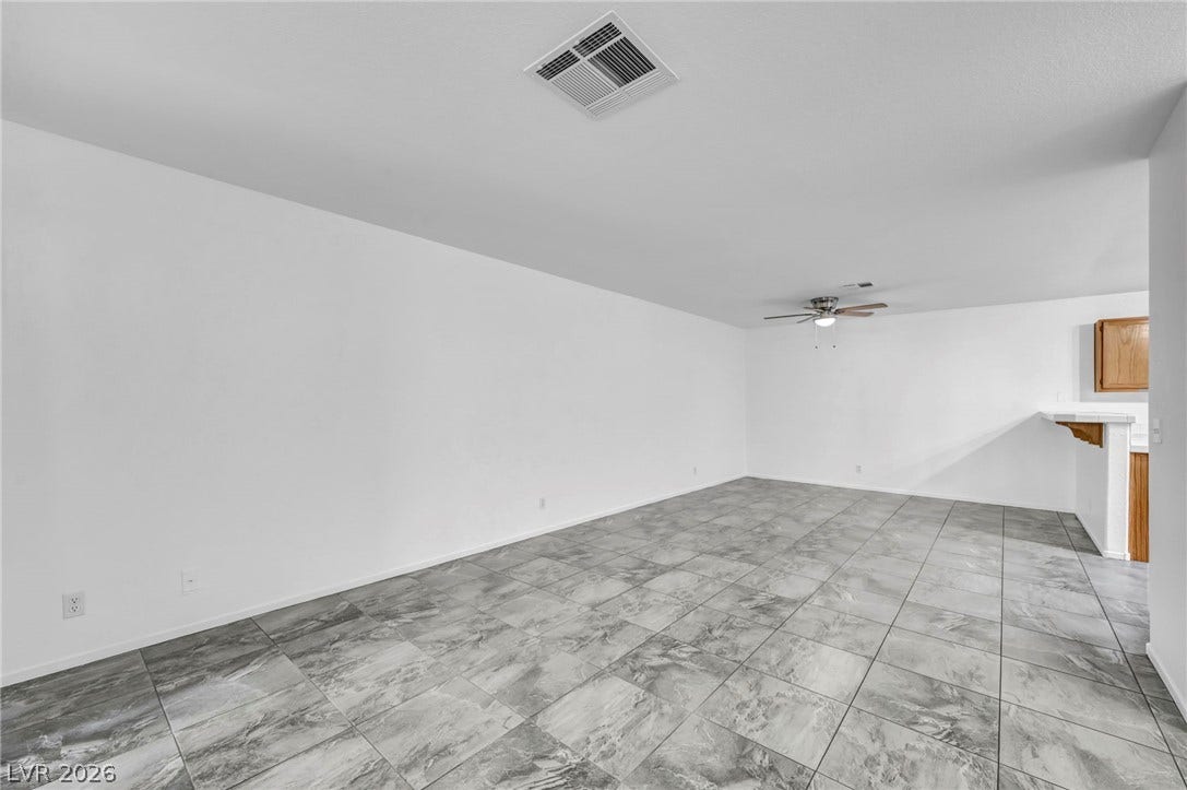 3613 Shawn Reynolds Court, #104, Las Vegas, NV 89129 An open layout flows seamlessly across large tiled floors in this versatile space.