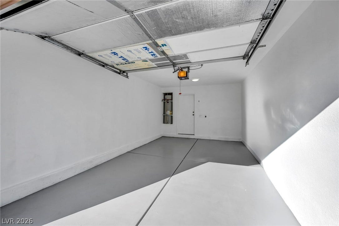 3613 Shawn Reynolds Court, #104, Las Vegas, NV 89129 A clean garage space features concrete floors and direct access inside the home.