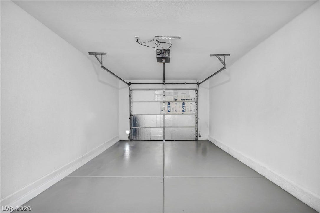 3613 Shawn Reynolds Court, #104, Las Vegas, NV 89129 Smooth concrete floors and finished walls define this clean garage space.