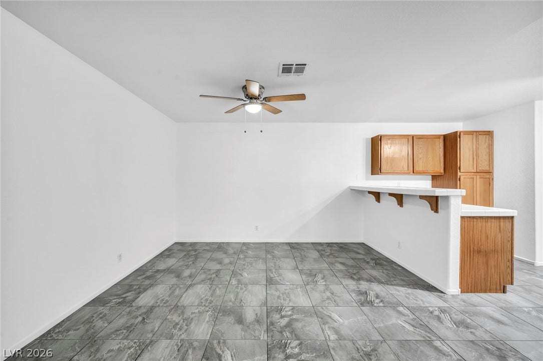 3613 Shawn Reynolds Court, #104, Las Vegas, NV 89129 Durable tile flooring anchors an open dining area next to the breakfast bar.