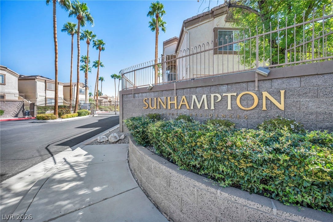 3613 Shawn Reynolds Court, #104, Las Vegas, NV 89129 Manicured landscaping surrounds the entry monument of this gated residential community.