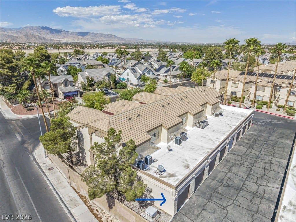 3613 Shawn Reynolds Court, #104, Las Vegas, NV 89129 An aerial perspective of location of unit's 1 car garage, marked by arrow