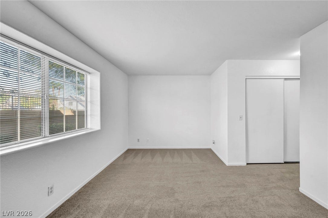 3613 Shawn Reynolds Court, #104, Las Vegas, NV 89129 Clean lines and soft carpeting define this versatile secondary bedroom space.