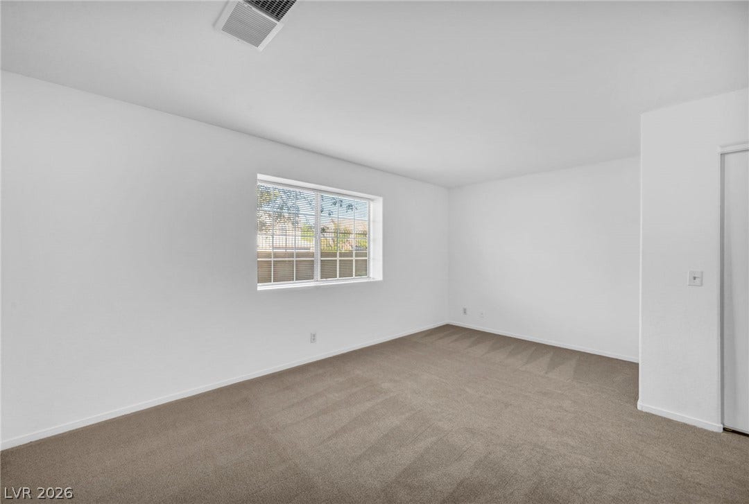 3613 Shawn Reynolds Court, #104, Las Vegas, NV 89129 Plush carpeting and a wide window define this comfortable private space.