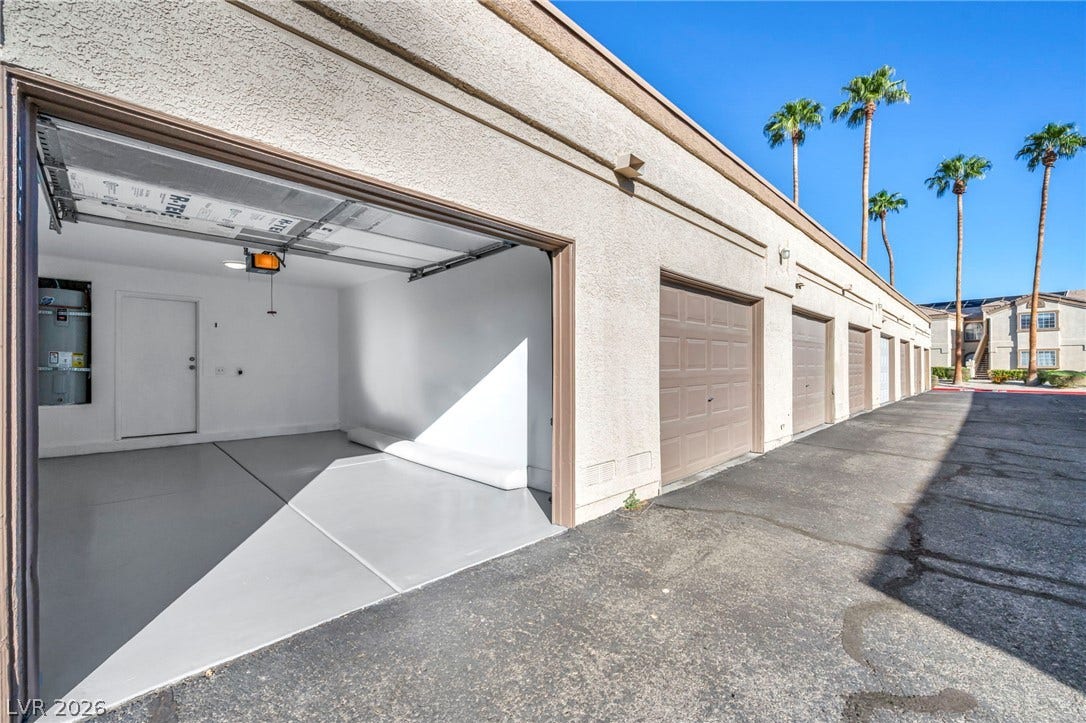 3613 Shawn Reynolds Court, #104, Las Vegas, NV 89129 An attached garage provides secure storage and convenient parking in a sun-drenched setting.