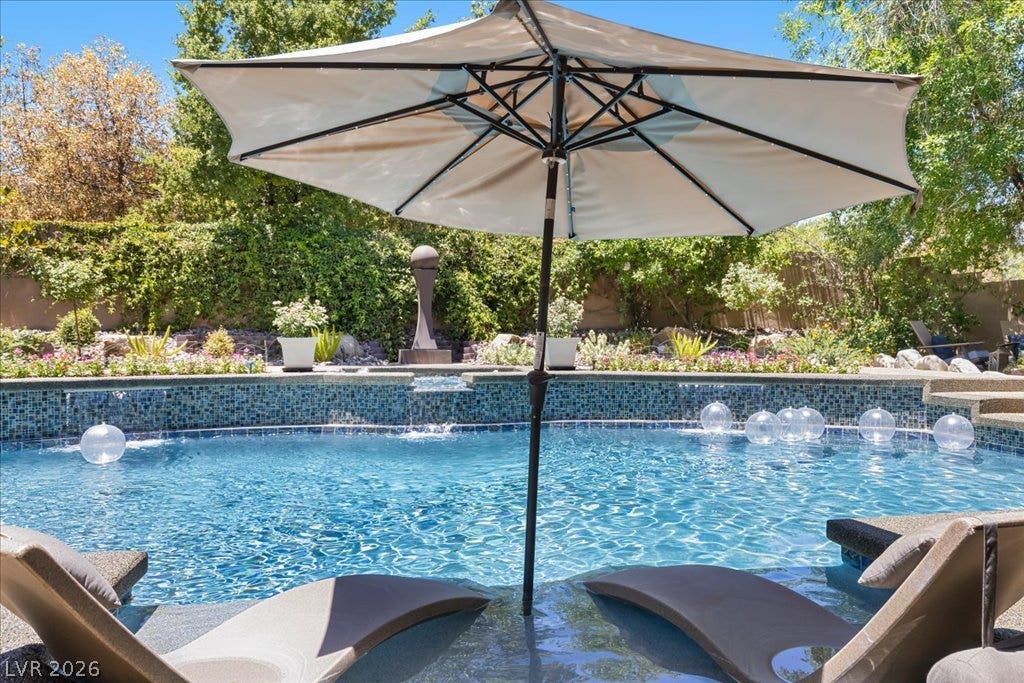 2985 American River Lane, Las Vegas, NV 89135 Sparkling pool with water feature, perfect for relaxation.