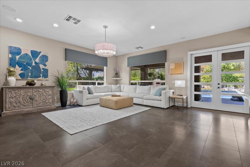 2985 American River Lane, Las Vegas, NV 89135 Inviting living space with tile flooring and backyard access.