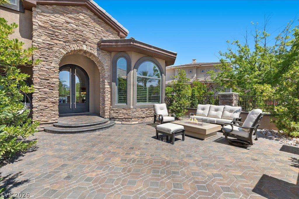 2985 American River Lane, Las Vegas, NV 89135 Inviting patio with a fire pit create a charming outdoor retreat.