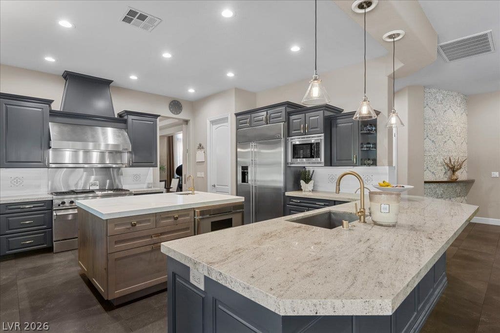 2985 American River Lane, Las Vegas, NV 89135 Modern kitchen designed with dual islands for cooking and entertaining.