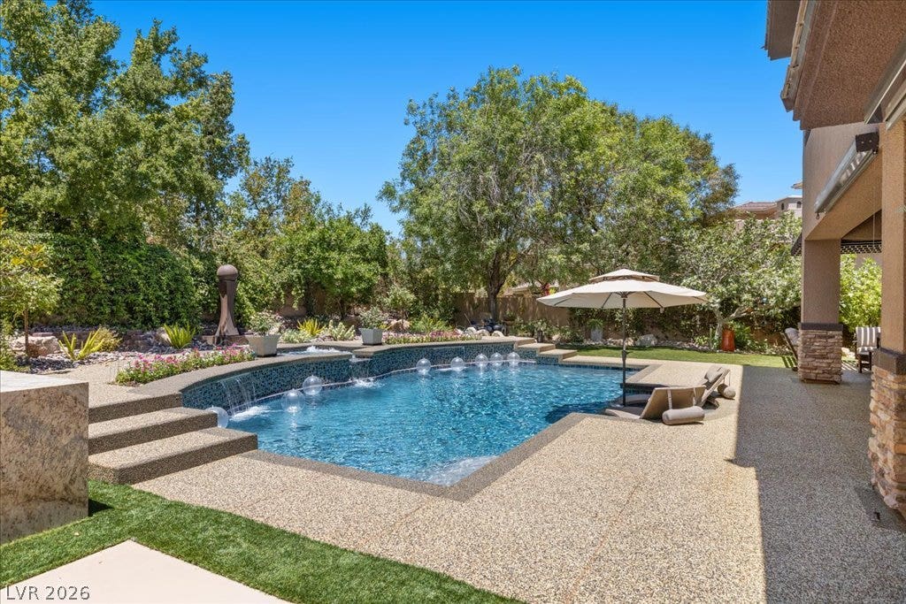 2985 American River Lane, Las Vegas, NV 89135 Tranquil oasis with a sparkling pool and water features.