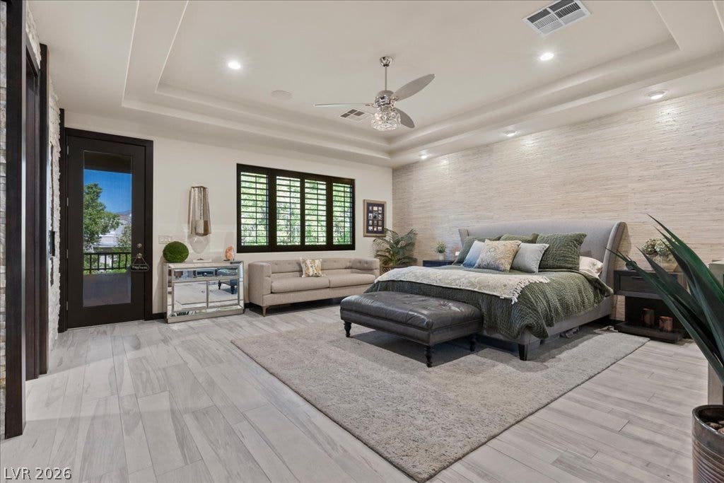2985 American River Lane, Las Vegas, NV 89135 Inviting primary suite with recessed lighting and balcony.