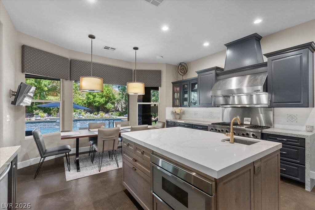 2985 American River Lane, Las Vegas, NV 89135 Open kitchen designed to enjoy views of the private pool.