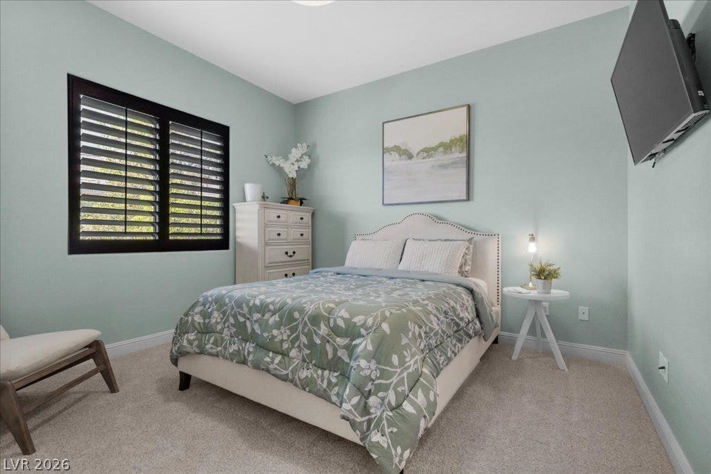 2985 American River Lane, Las Vegas, NV 89135 Inviting bedroom with soft carpeting and natural light.