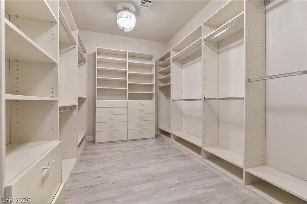 2985 American River Lane, Las Vegas, NV 89135 Dressing room with customizable shelving and ample storage.