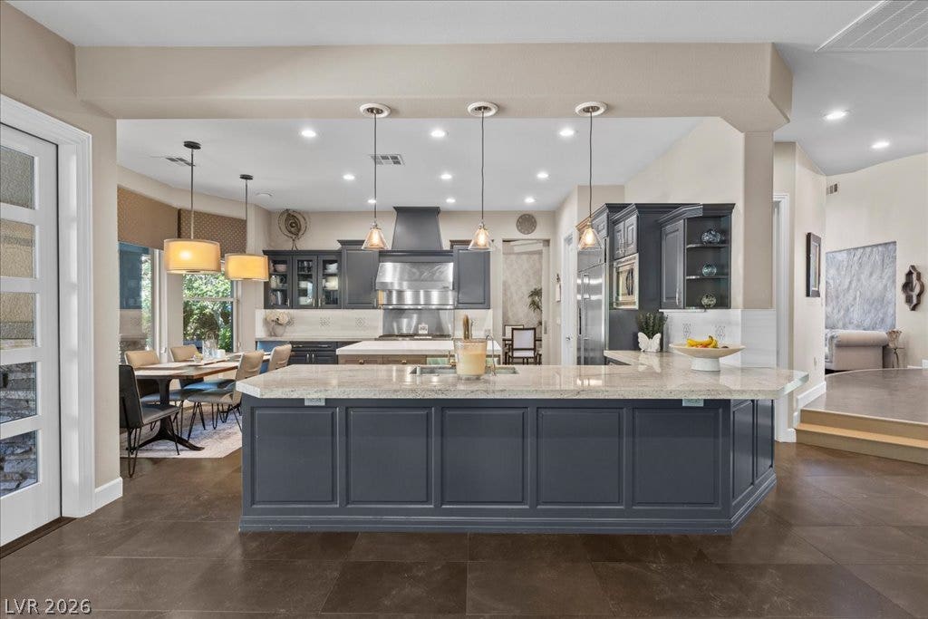 2985 American River Lane, Las Vegas, NV 89135 Elegant kitchen with stainless steel appliances and generous workspace.