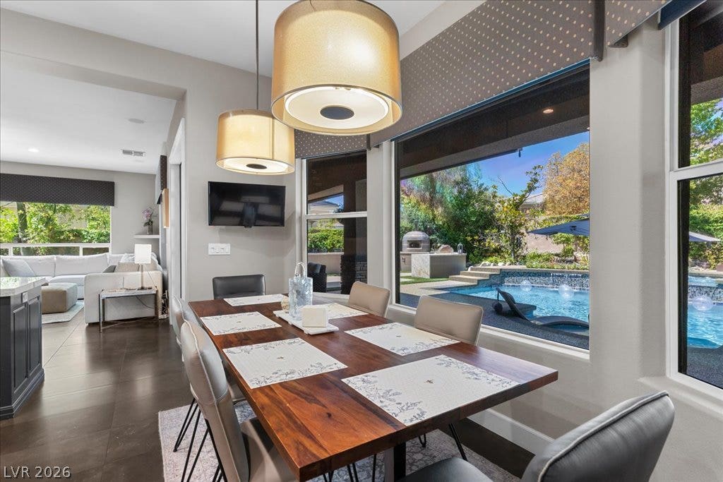 2985 American River Lane, Las Vegas, NV 89135 Enjoy pool views from this welcoming dining area.