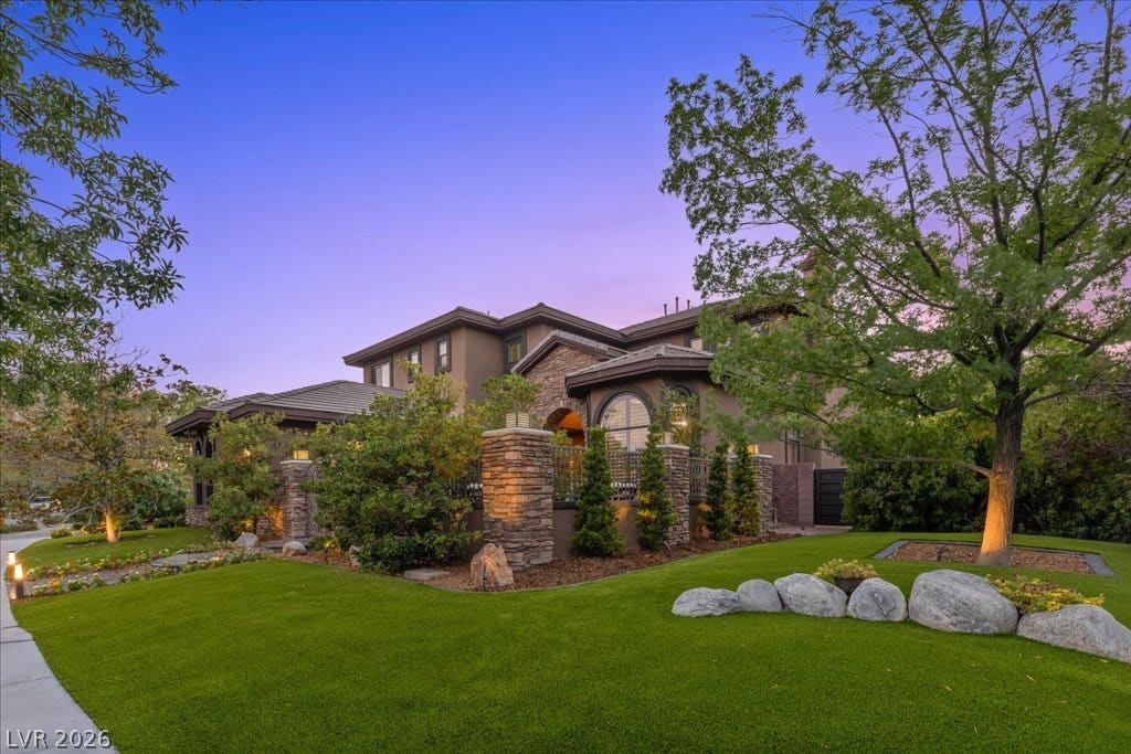 2985 American River Lane, Las Vegas, NV 89135 Impressive curb appeal with stone pillars and timeless design.