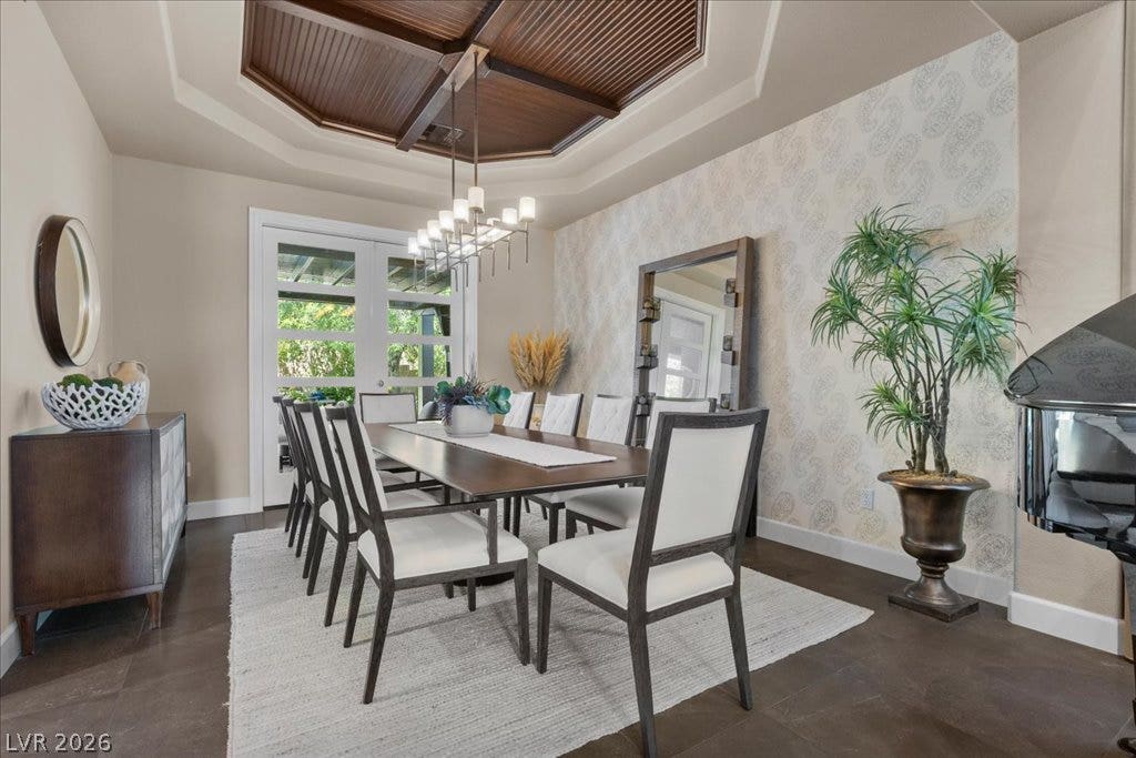 2985 American River Lane, Las Vegas, NV 89135 Elegant dining room featuring French doors and wood ceiling details.