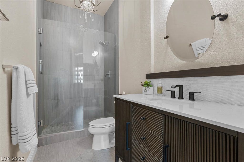 2985 American River Lane, Las Vegas, NV 89135 Elegant shower and vanity with contemporary finishes.