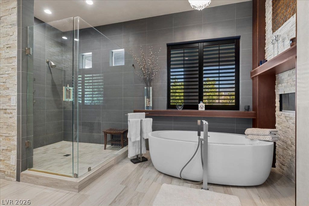 2985 American River Lane, Las Vegas, NV 89135 Serene bathroom featuring a standalone tub and walk-in shower.