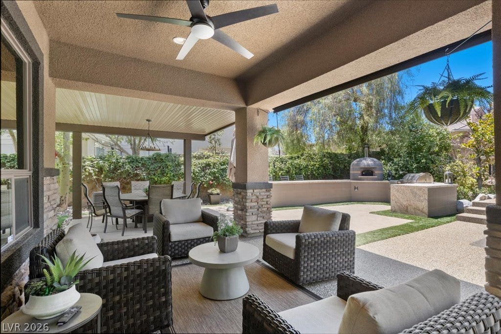 2985 American River Lane, Las Vegas, NV 89135 Resort-style outdoor living with covered seating and kitchen.