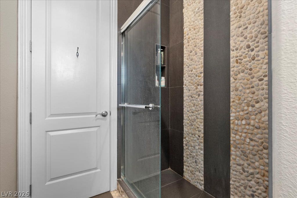 2985 American River Lane, Las Vegas, NV 89135 Contemporary shower with elegant pebble details.
