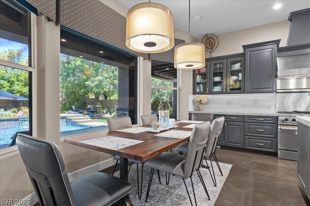 2985 American River Lane, Las Vegas, NV 89135 Inviting dining space overlooking the swimming pool.